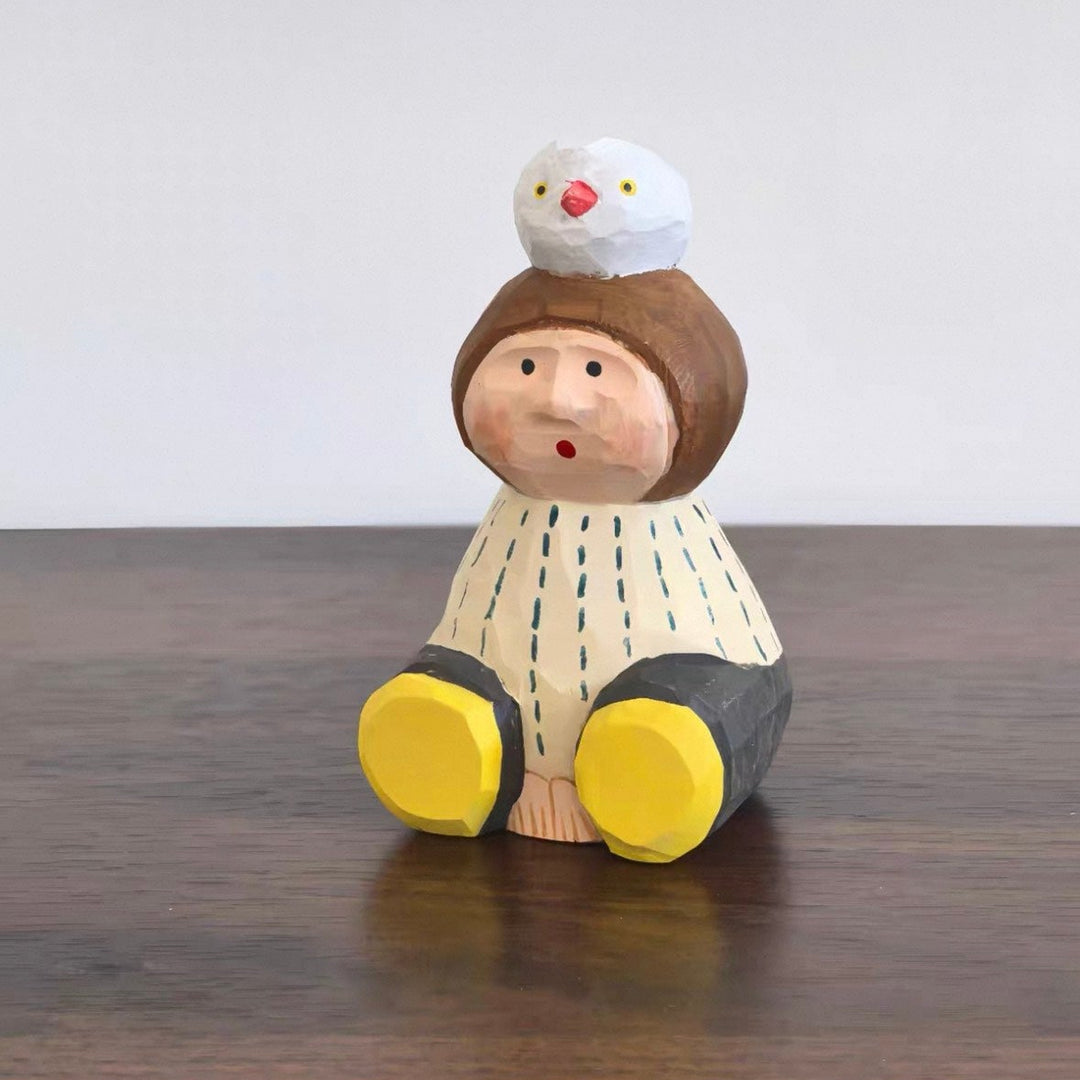 Wooden kid with Bird Figurine